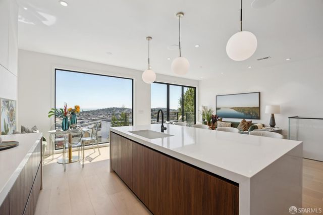 a living room with furniture and large window