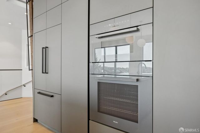 a view of a patio with furniture and a grill