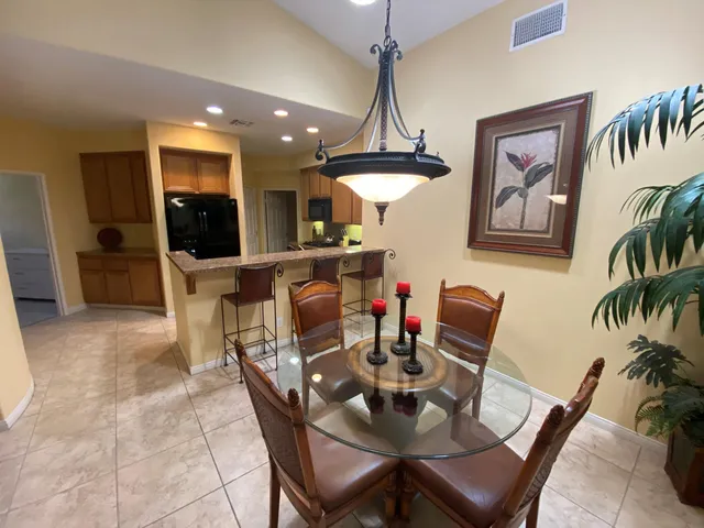a view of a dining room with furniture