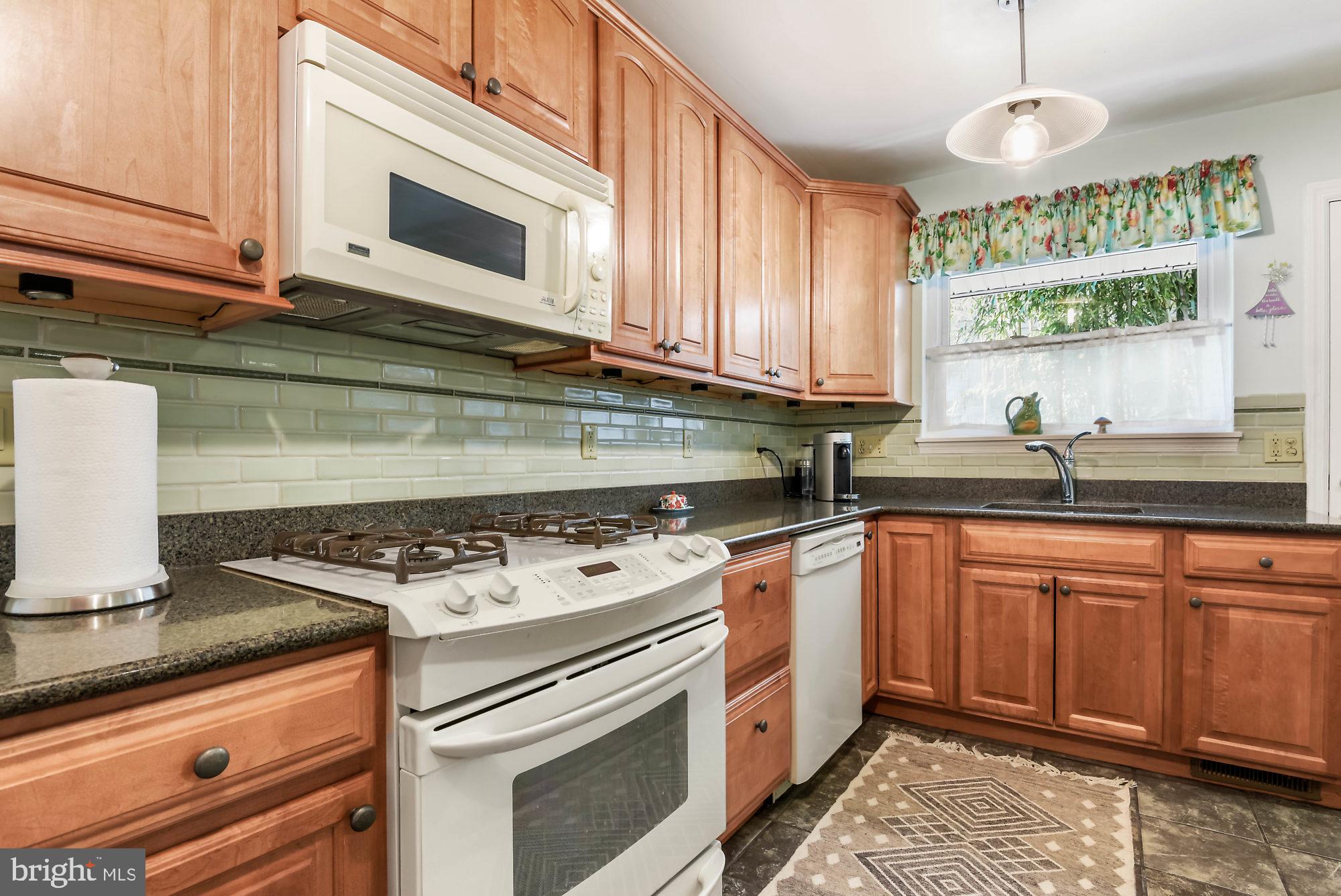 2108 Carterdale Road Baltimore, MD 21209 - Photo 8 of 22 Sunny kitchen with a gas range