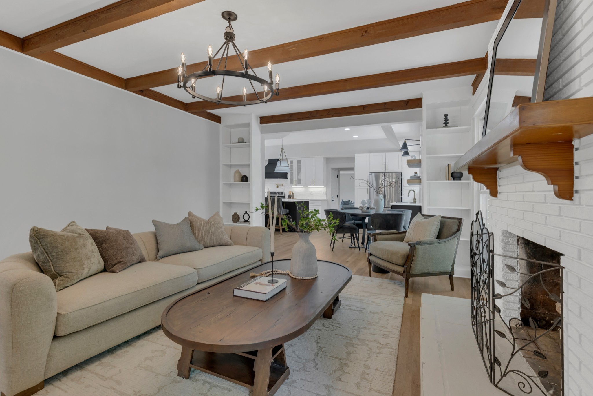 608 Hill Road Nashville, TN 37220 - Photo 16 of 44 a living room with furniture a fireplace and a chandelier