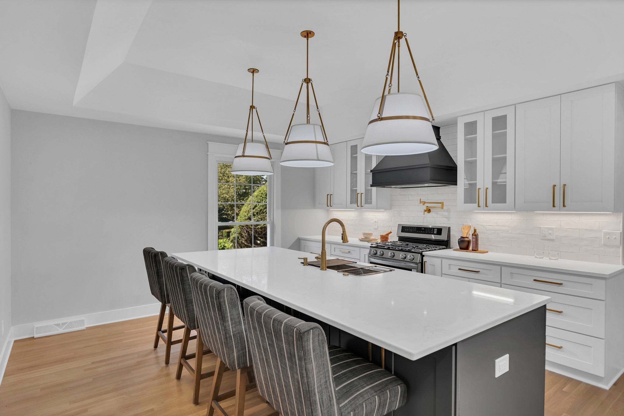608 Hill Road Nashville, TN 37220 - Photo 20 of 44 a kitchen that has a kitchen island a stove a counter space and a sink