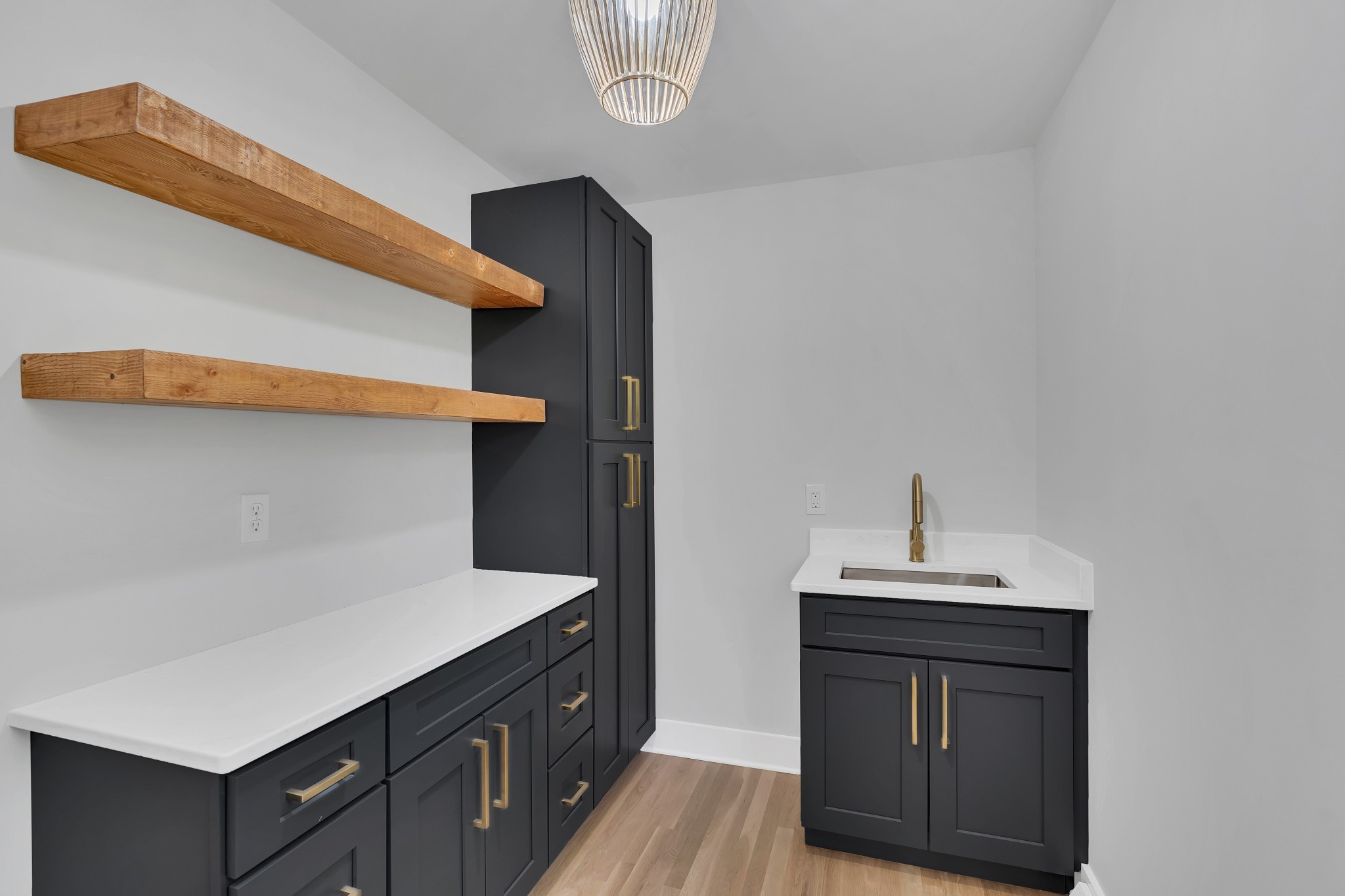 608 Hill Road Nashville, TN 37220 - Photo 23 of 44 a kitchen with a sink cabinets and wooden floor