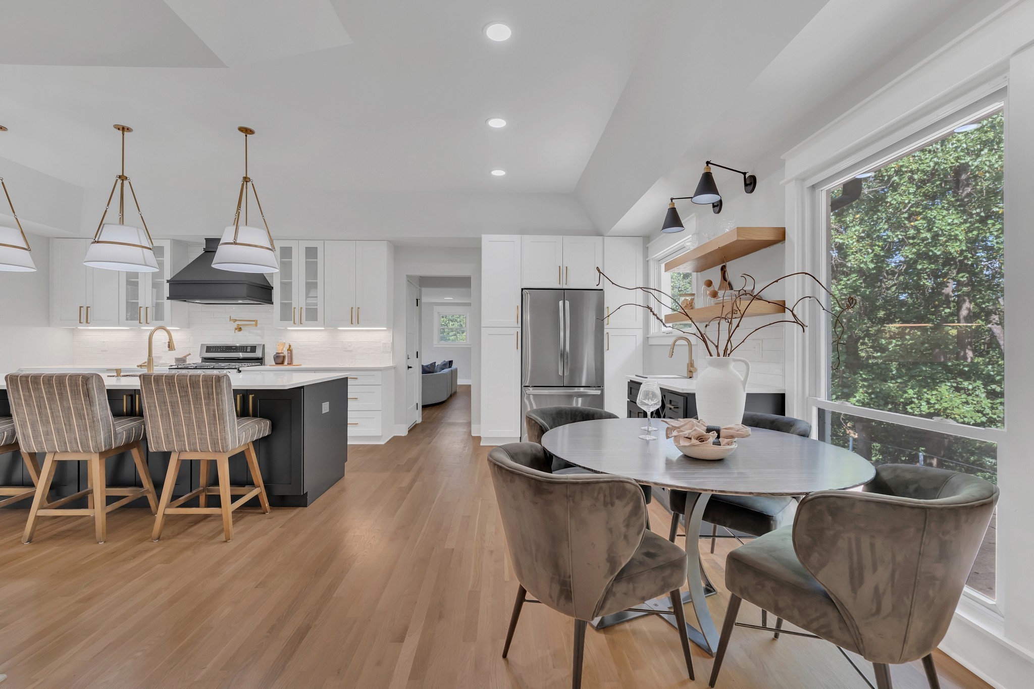 608 Hill Road Nashville, TN 37220 - Photo 3 of 44 a dining room with furniture a chandelier and wooden floor