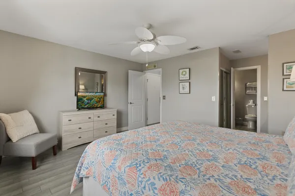 a kitchen with a refrigerator sink and cabinets
