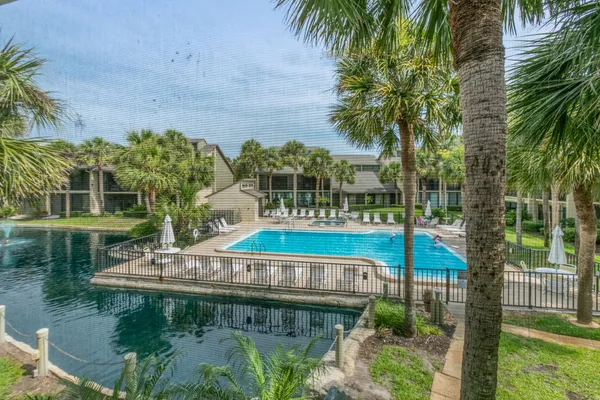 a view of a swimming pool with a patio