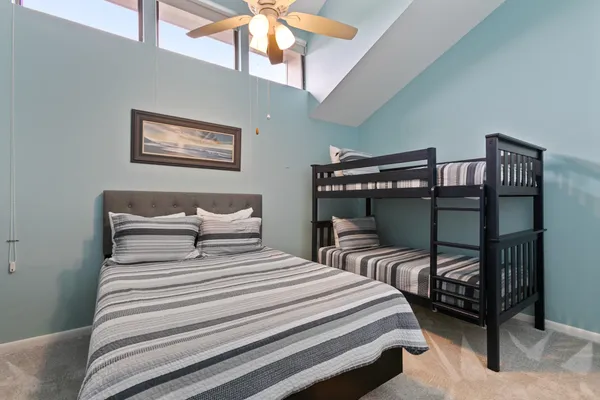 an aerial view of residential building and lake