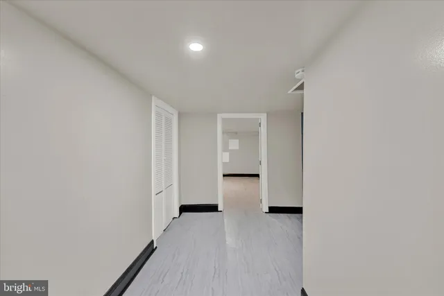 a view of a room with wooden floor and staircase