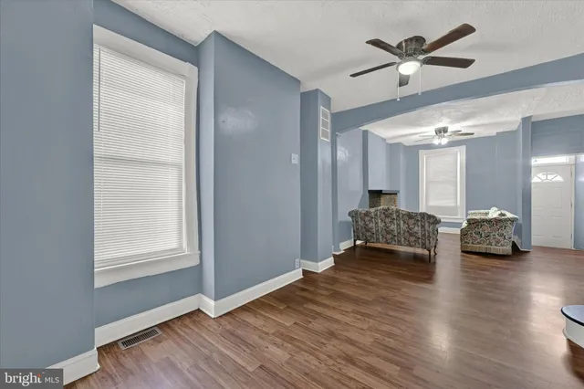 a view of a livingroom with furniture and wooden floor