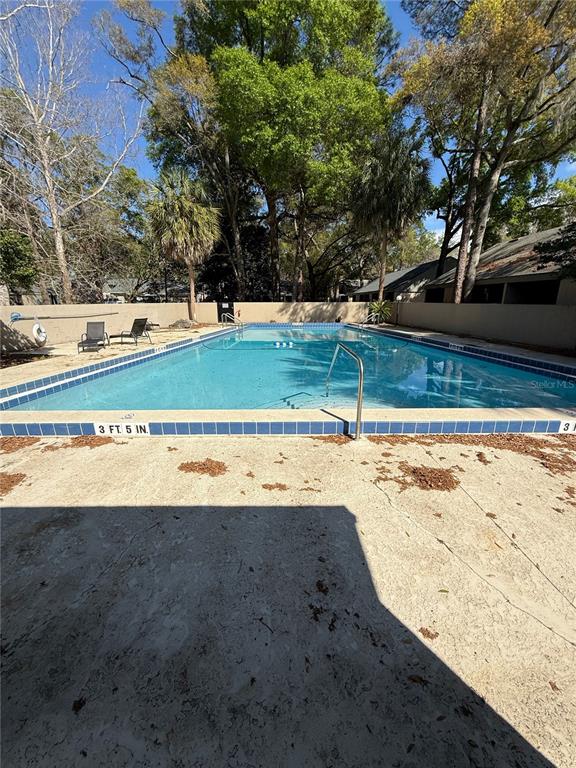 7200 Southwest 8th Avenue, Unit T128 Gainesville, FL 32607 - Photo 36 of 38 a view of a yard with large trees
