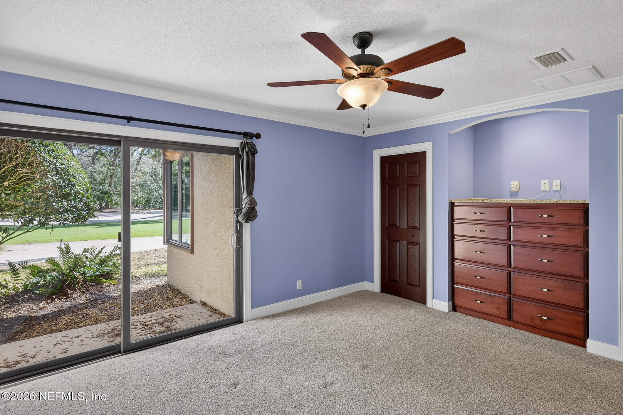 3301 Sea Marsh Road Fernandina Beach, FL 32034 - Photo 21 of 41 a view of a livingroom with a ceiling fan and window