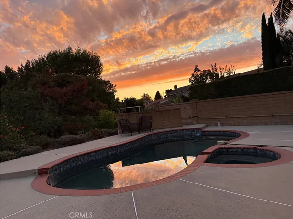 a view of swimming pool from a balcony