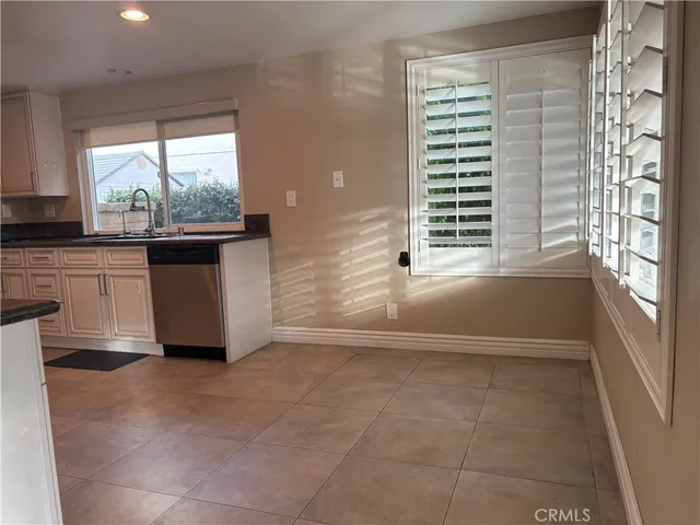 a view of a kitchen with furniture and a window