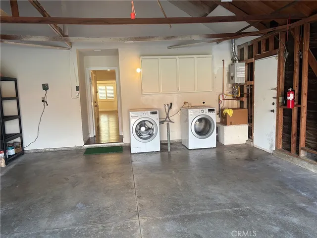 a view of a storage & utility room with washer and dryer