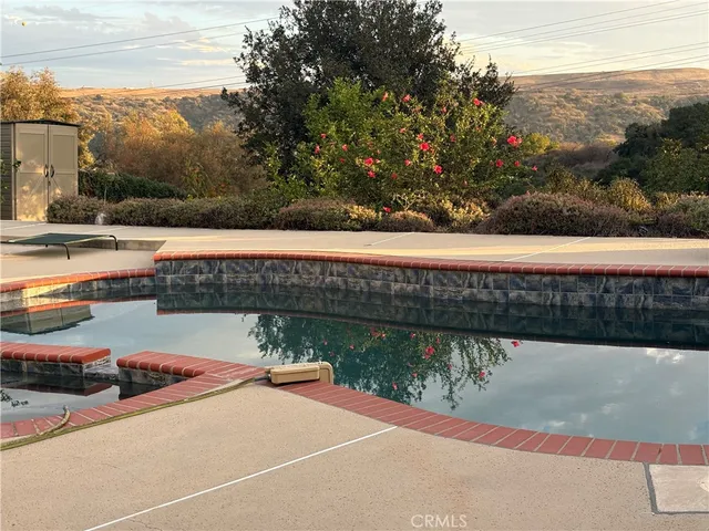 a view of a swimming pool with a patio