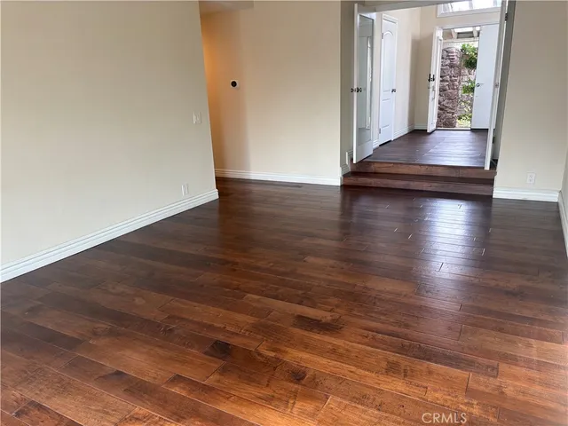 a view hallway with wooden floor
