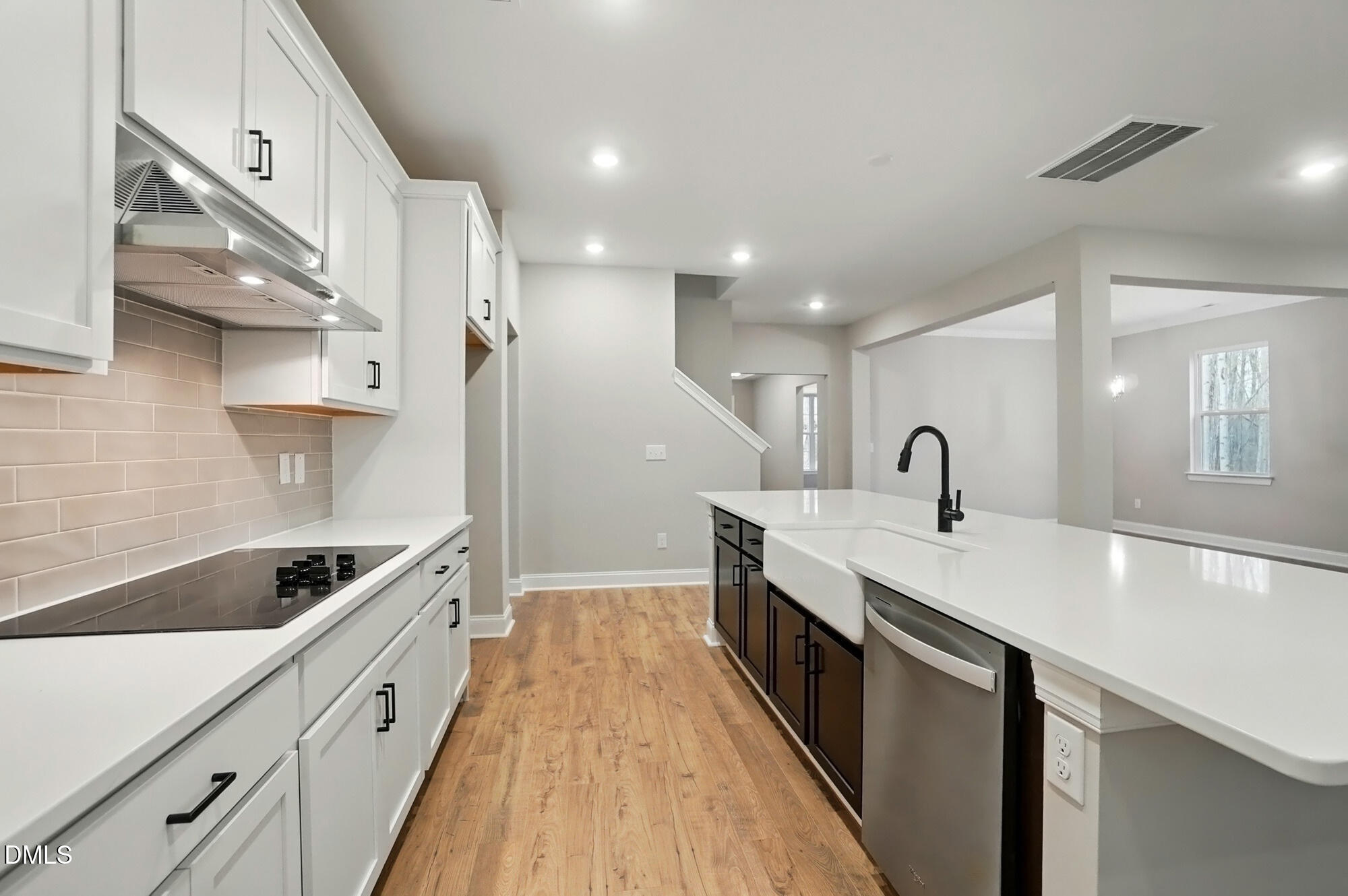 285 Gilliland Road Siler City, NC 27344 - Photo 14 of 45 a kitchen with counter top space a sink stainless steel appliances and cabinets