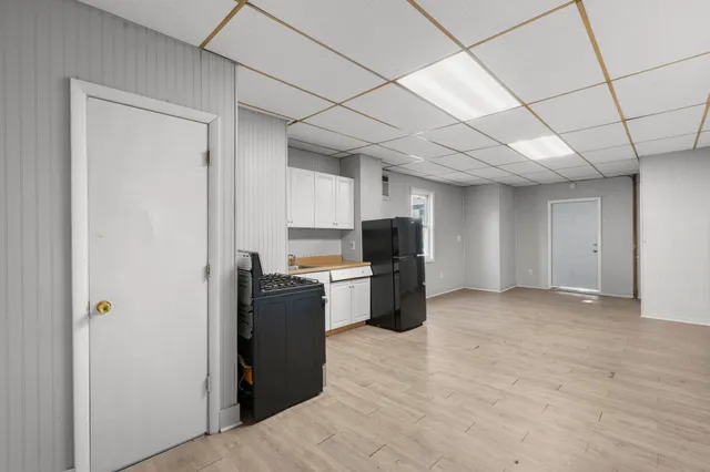 a kitchen with stainless steel appliances granite countertop a refrigerator stove and a sink