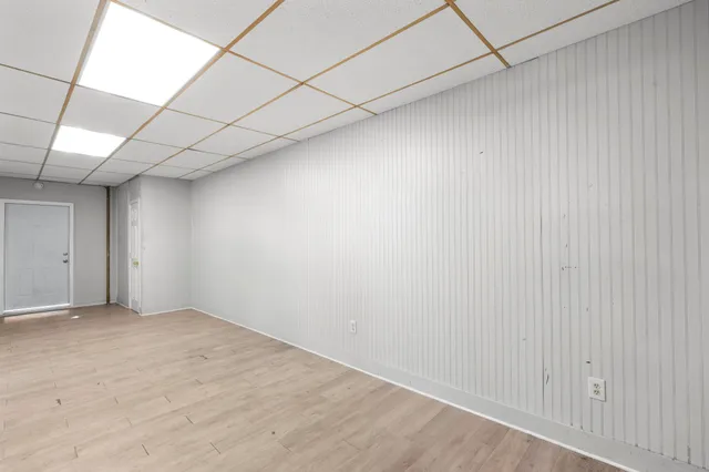 a kitchen with refrigerator and microwave