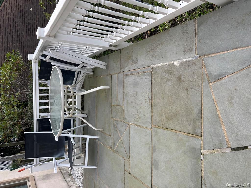 80 Harbor Beach Road Miller Place, NY 11764 - Photo 3 of 10 a view of deck with chairs and wooden fence