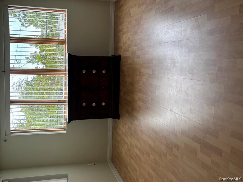 80 Harbor Beach Road Miller Place, NY 11764 - Photo 9 of 10 an empty room with a window