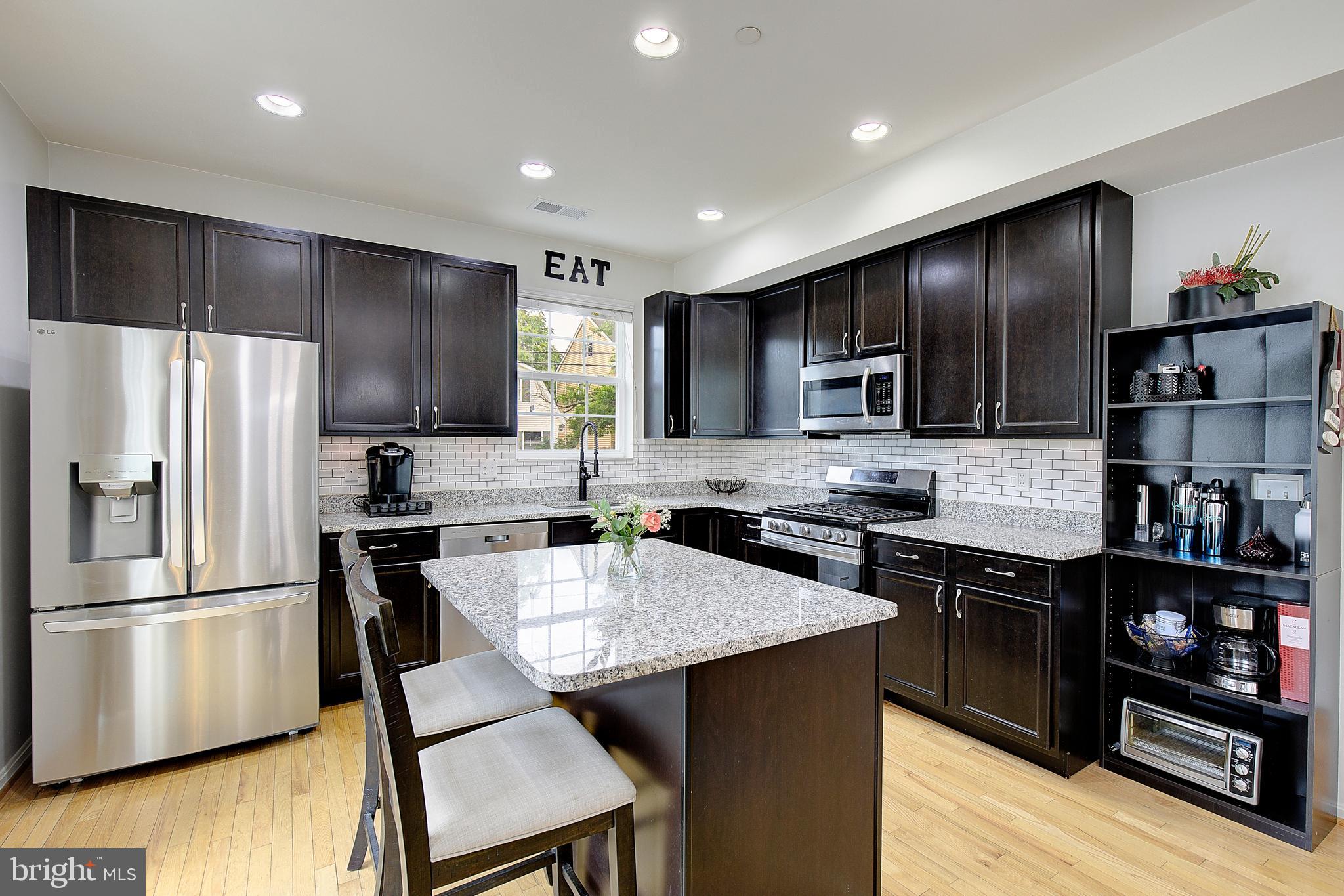 403 Venton Road Edgewater, MD 21037 - Photo 18 of 62 a kitchen with a refrigerator a stove a sink and a refrigerator