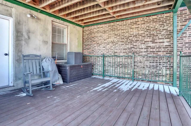 a view of outdoor space with wooden floor