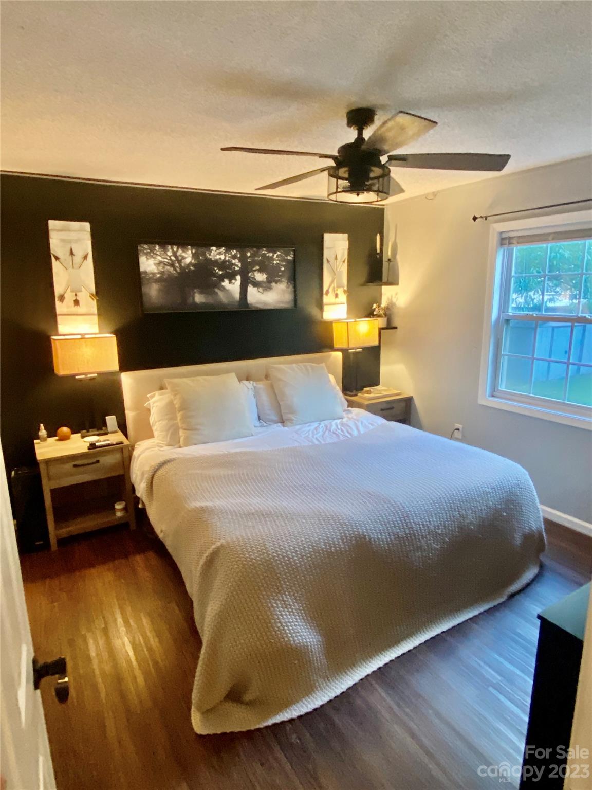 9701 Hambright Road Huntersville, NC 28078 - Photo 11 of 17 a bedroom with a bed and wooden floor