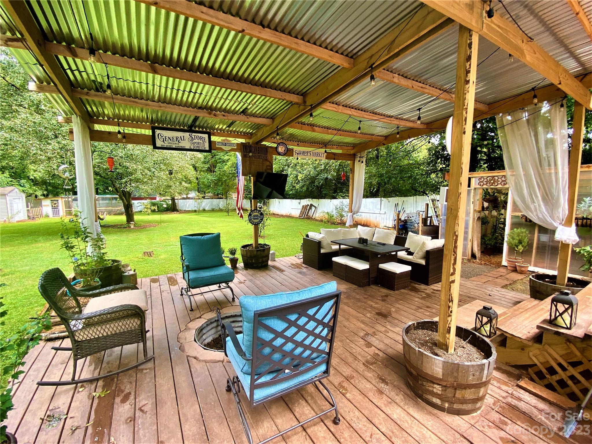 9701 Hambright Road Huntersville, NC 28078 - Photo 4 of 17 a view of a patio with dining table and chairs