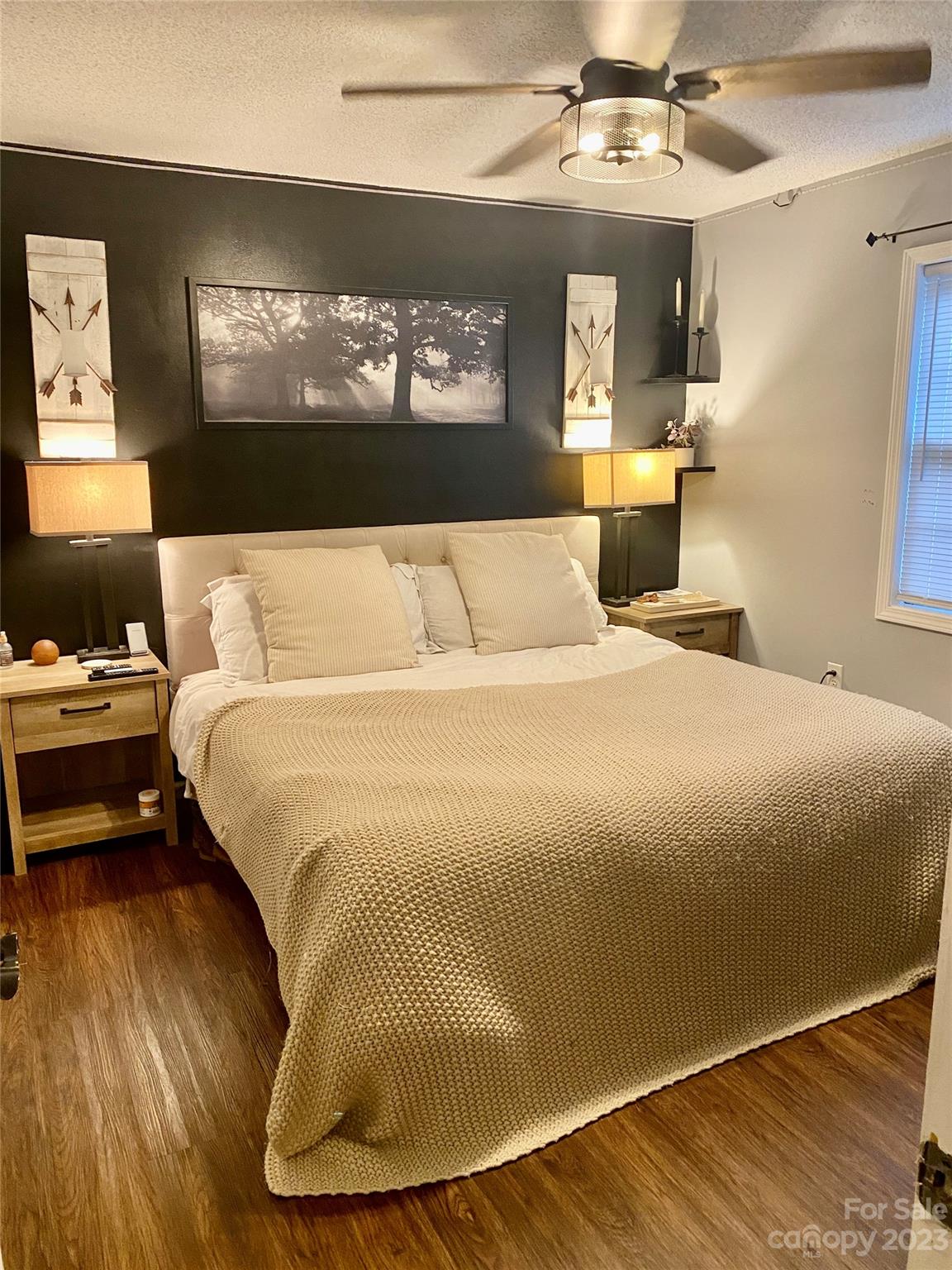 9701 Hambright Road Huntersville, NC 28078 - Photo 10 of 17 a spacious bedroom with a bed and a flat screen tv