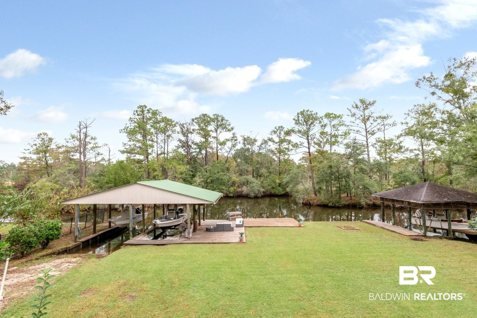 3500 North Riviere Du Chien Loop Mobile, AL 36693 - Photo 49 of 74 View of yard featuring a water view and a dock