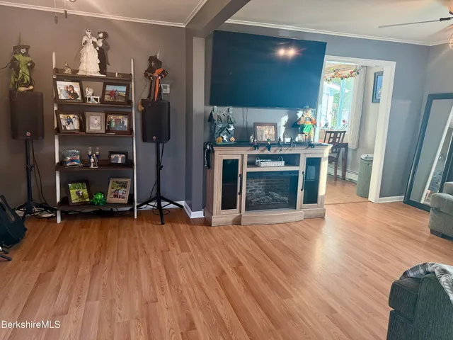 a view of a dentist room with wooden floor and furniture