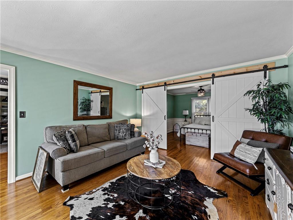 215 Pineywood Road Griffin, GA 30224 - Photo 12 of 49 a living room with furniture and wooden floor