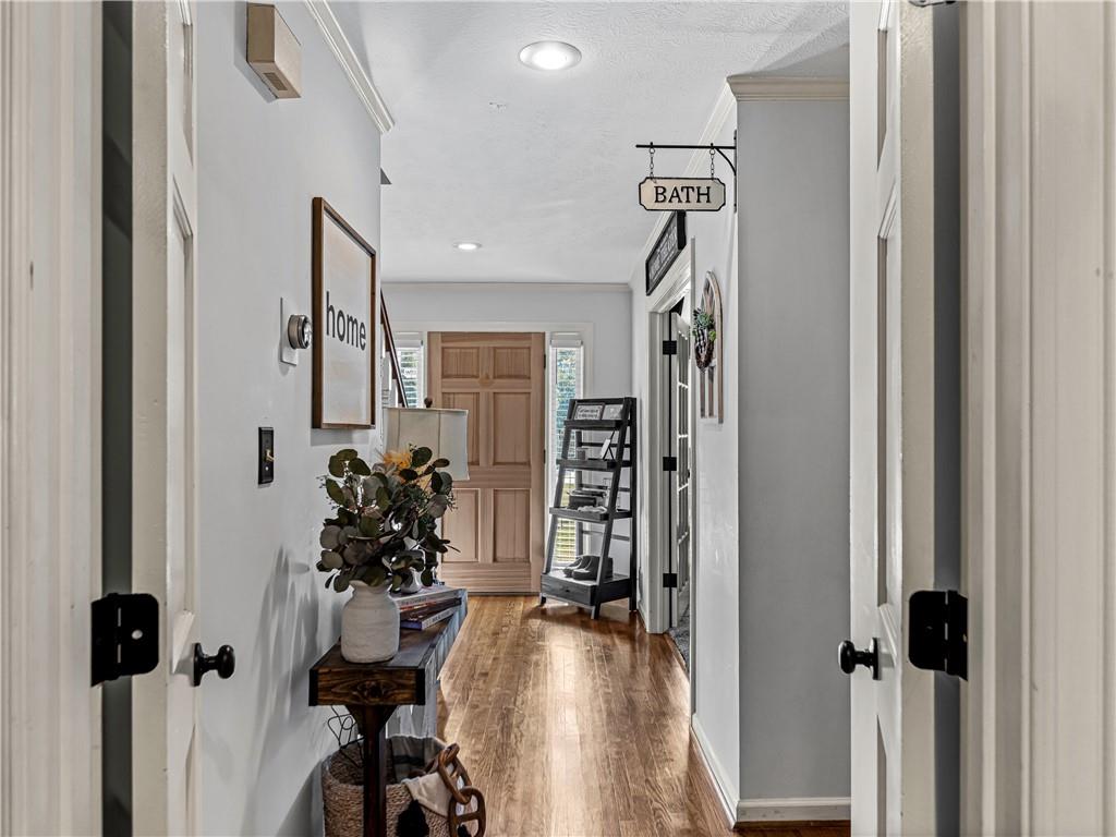 215 Pineywood Road Griffin, GA 30224 - Photo 27 of 49 a view of a hallway with wooden floor and windows