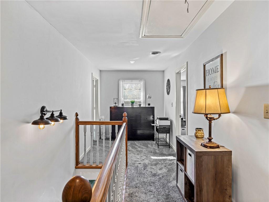 215 Pineywood Road Griffin, GA 30224 - Photo 28 of 49 a living room with furniture and a flat screen tv