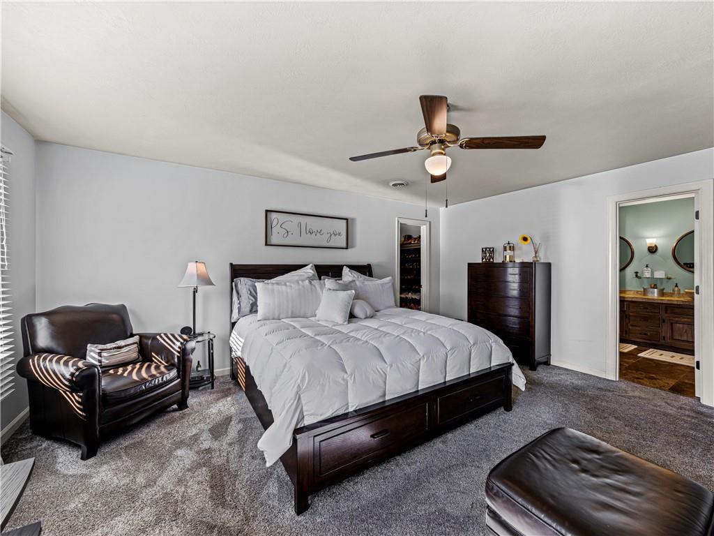 215 Pineywood Road Griffin, GA 30224 - Photo 35 of 49 a spacious bedroom with a bed and ceiling fan