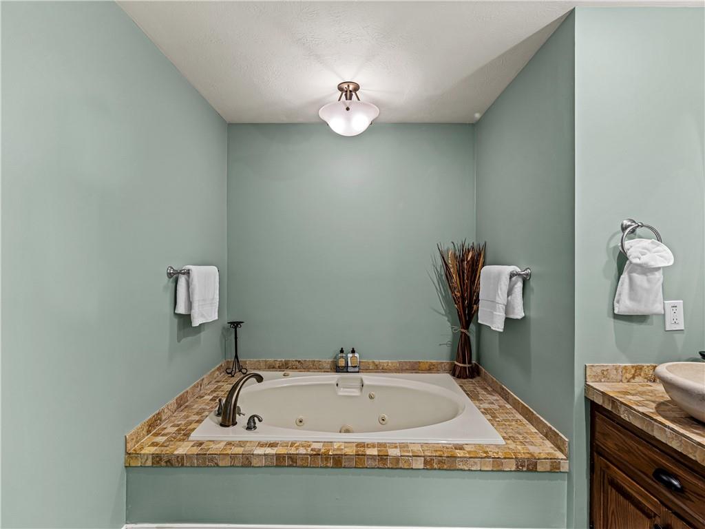 215 Pineywood Road Griffin, GA 30224 - Photo 37 of 49 a view of cabinet with a sink and mirror