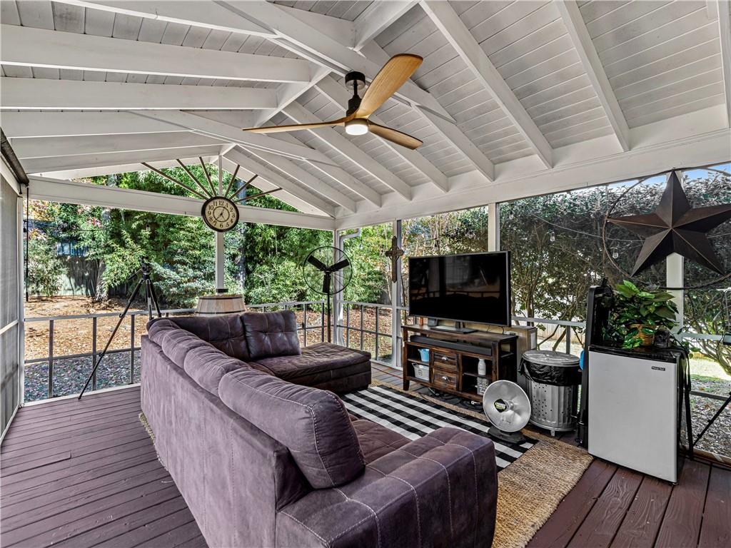 215 Pineywood Road Griffin, GA 30224 - Photo 40 of 49 a living room with furniture and a flat screen tv