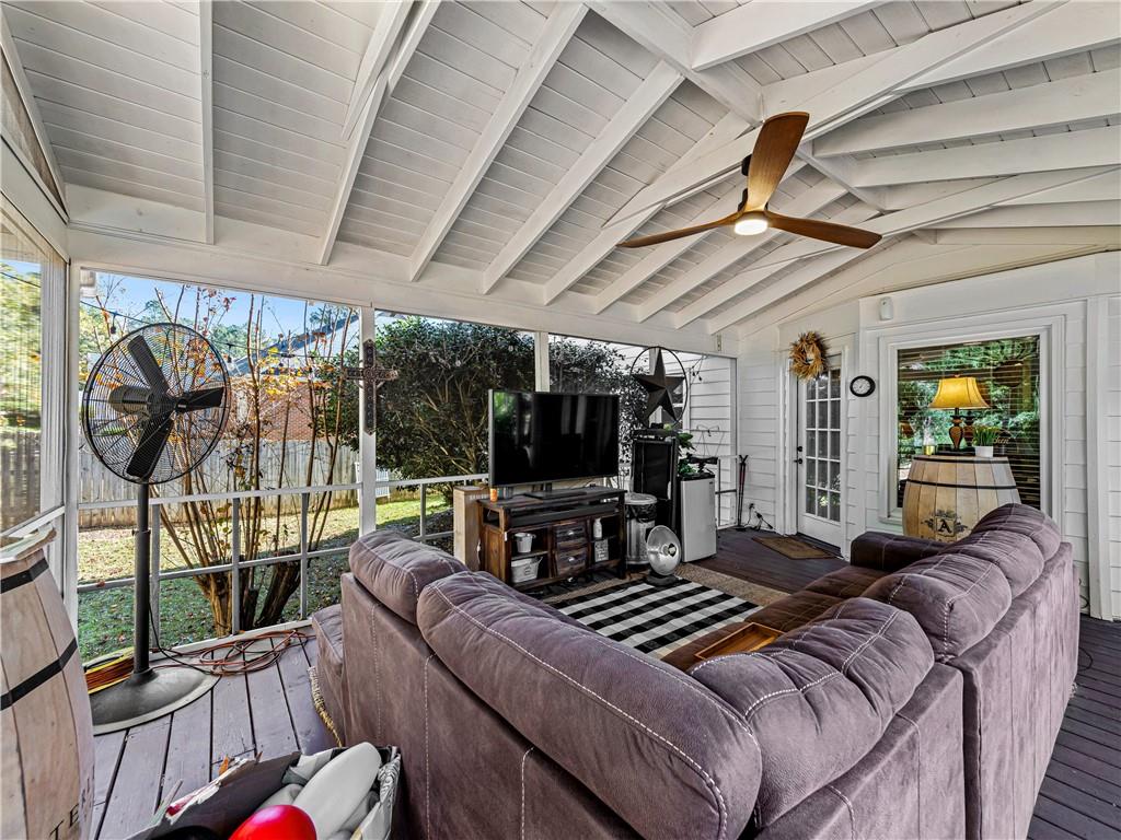 215 Pineywood Road Griffin, GA 30224 - Photo 41 of 49 a bedroom with furniture and a flat screen tv