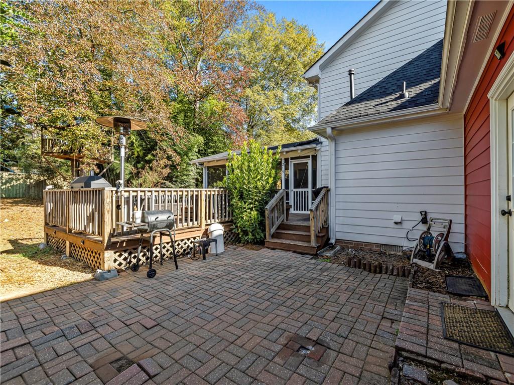 215 Pineywood Road Griffin, GA 30224 - Photo 43 of 49 a bench sitting in front of a house