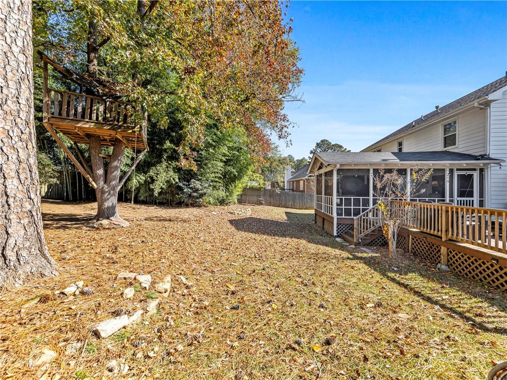 215 Pineywood Road Griffin, GA 30224 - Photo 44 of 49 a view of a house with wooden fence