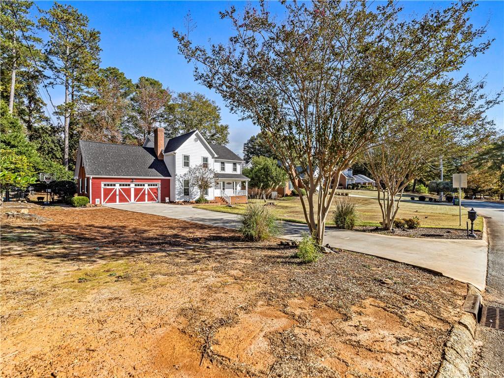 215 Pineywood Road Griffin, GA 30224 - Photo 6 of 49 a view of road with large trees