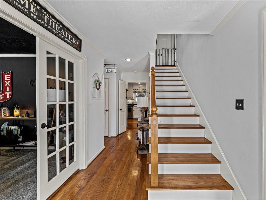 215 Pineywood Road Griffin, GA 30224 - Photo 9 of 49 a view of a hallway with wooden floor and windows