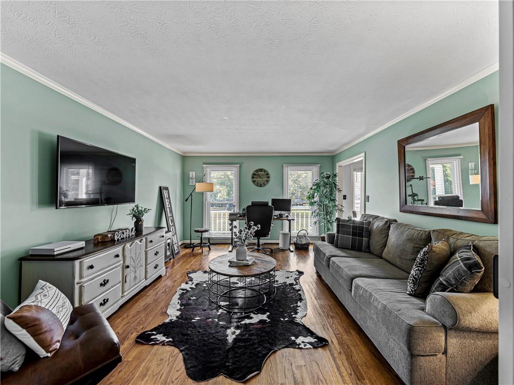 215 Pineywood Road Griffin, GA 30224 - Photo 10 of 49 a living room with furniture and a flat screen tv