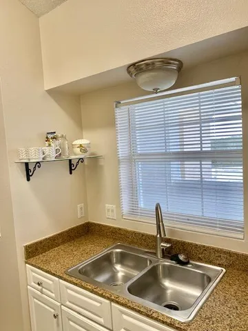 a bathroom with a sink and a vanity