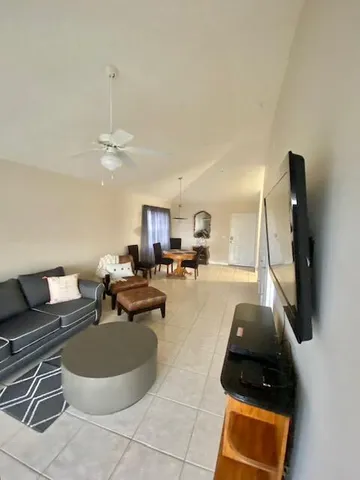 a living room with a couch and a flat screen tv