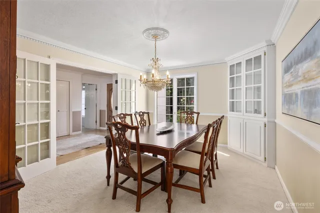 a dining room with furniture and window