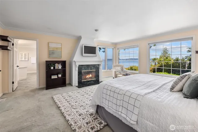 a bed room with a bed and a fireplace