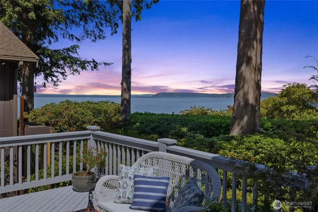 a view of a two chairs next to a yard