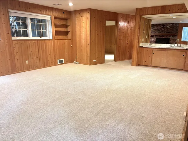 a view of a livingroom with a kitchen